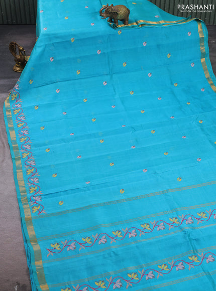 Silk cotton saree teal blue with floral convent embroidery buttas and zari woven border