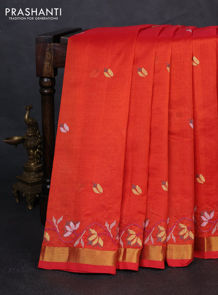 Silk cotton saree orange with floral convent embroidery buttas and zari woven border