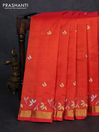 Silk cotton saree orange with floral convent embroidery buttas and zari woven border