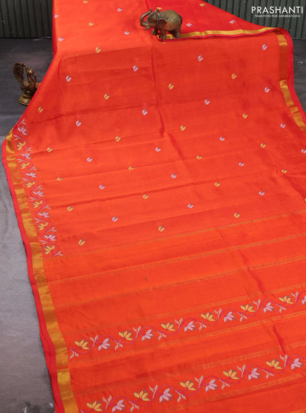 Silk cotton saree orange with floral convent embroidery buttas and zari woven border