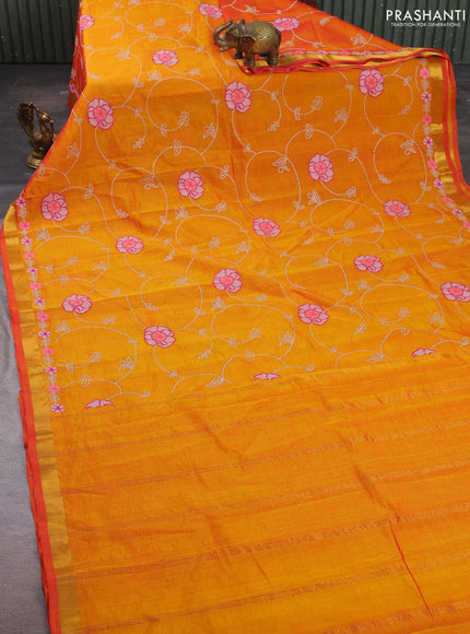 Silk cotton saree sunset orange with floral convent embroidery weaves and zari woven border