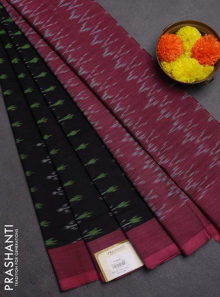 Ikat cotton saree black and peach pink with allover ikat woven butta weaves and simple border