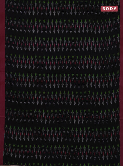 Ikat cotton saree black and peach pink with allover ikat woven butta weaves and simple border