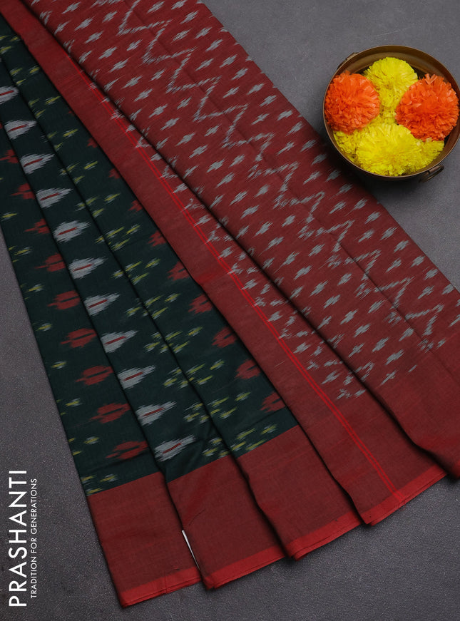 Ikat cotton saree bottle green and red with allover ikat woven butta weaves and simple border