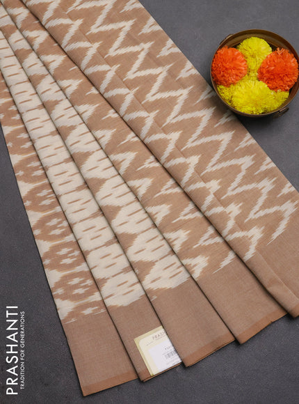 Ikat cotton saree off white and sandal with allover ikat weaves and simple border