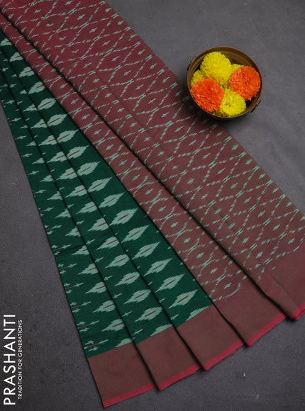 Ikat cotton saree bottle green and pink with allover ikat woven butta weaves and simple border
