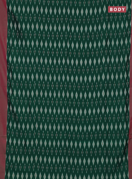 Ikat cotton saree bottle green and pink with allover ikat woven butta weaves and simple border
