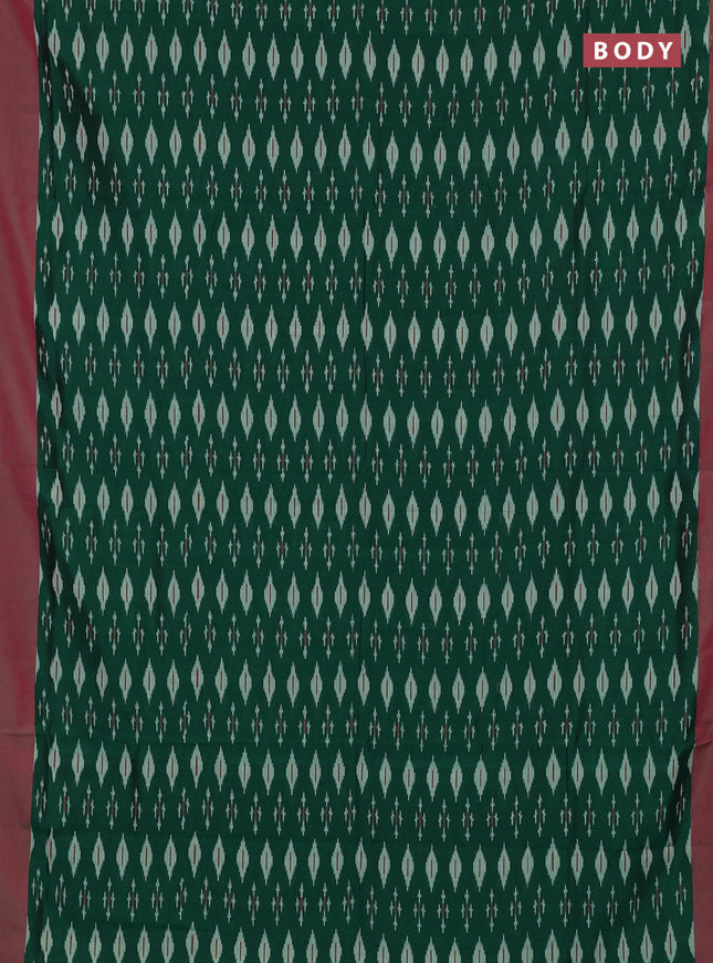 Ikat cotton saree bottle green and pink with allover ikat woven butta weaves and simple border