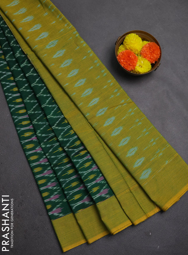 Ikat cotton saree bottle green and lime green with allover ikat woven butta weaves and simple border