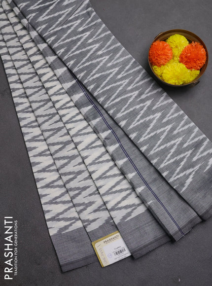 Ikat cotton saree off white and black with allover ikat zigzag weaves and simple border