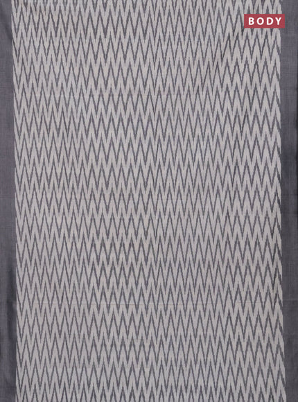 Ikat cotton saree off white and black with allover ikat zigzag weaves and simple border