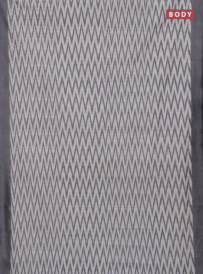 Ikat cotton saree off white and black with allover ikat zigzag weaves and simple border