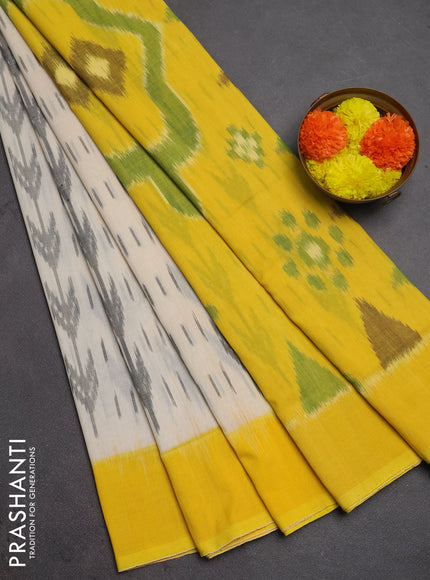 Ikat cotton saree off white and yellow with allover ikat weaves and simple border
