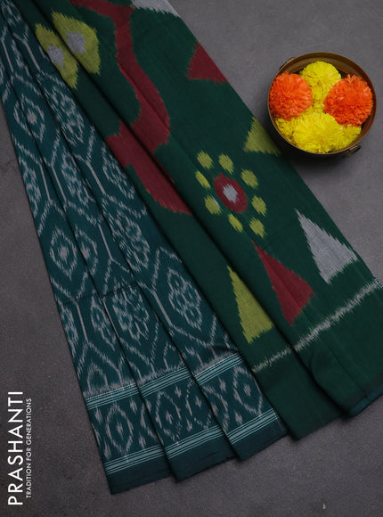 Ikat cotton saree peacock green with allover ikat woven butta weaves and ikat woven border