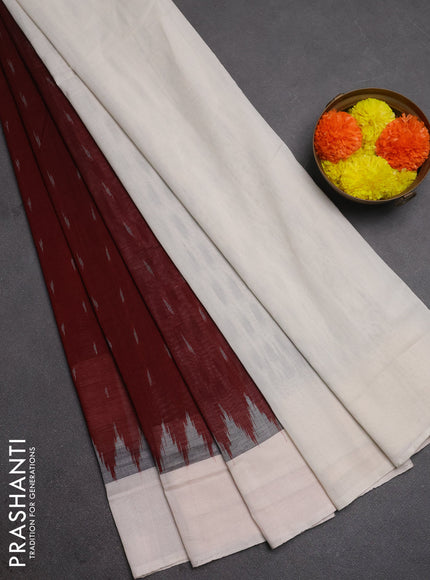 Ikat cotton saree deep maroon and off white with allover ikat woven butta weaves and simple border