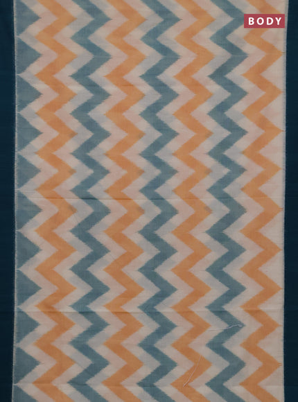 Ikat cotton saree off white and peacock green with allover ikat zigzag weaves and simple border