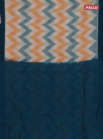 Ikat cotton saree off white and peacock green with allover ikat zigzag weaves and simple border