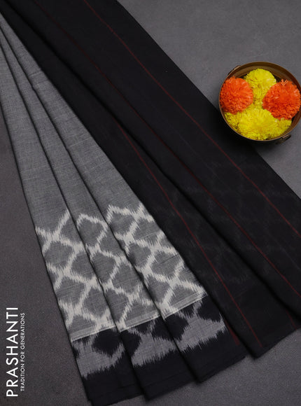 Ikat cotton saree grey and black with plain body and long ikat woven border