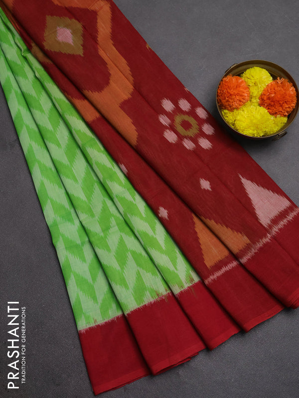 Ikat cotton saree light green and red with allover ikat zigzag weaves and simple border