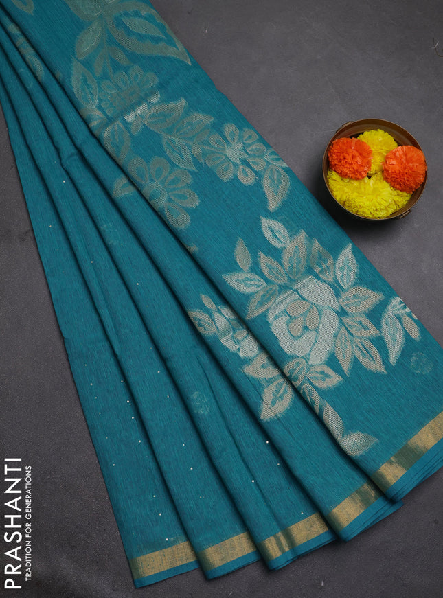 Jute silk saree teal blue with allover sequin work and zari woven border