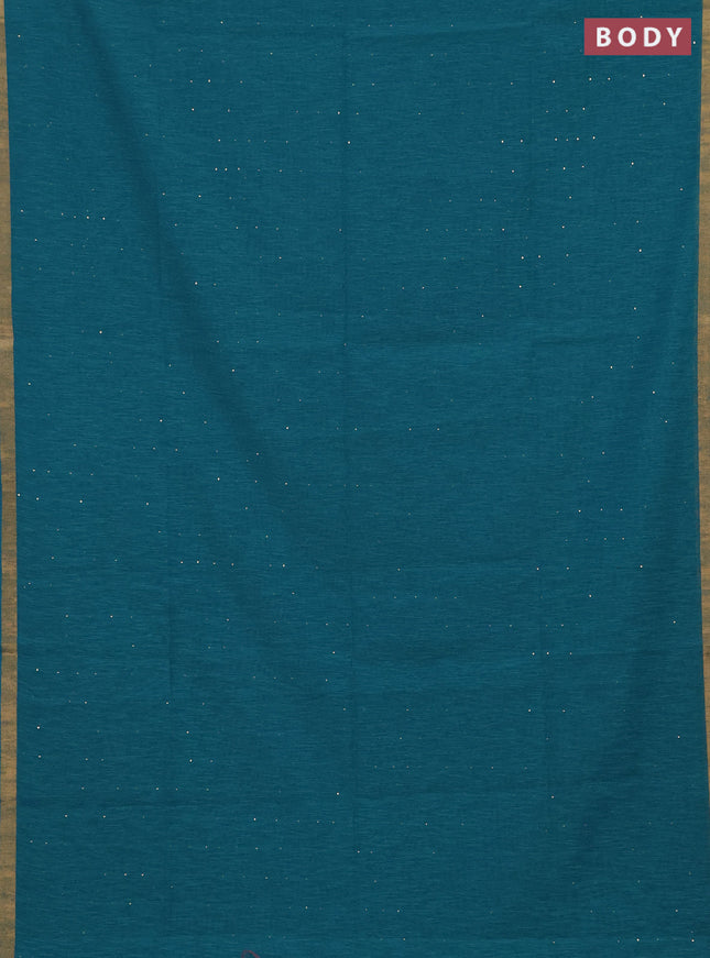 Jute silk saree teal blue with allover sequin work and zari woven border