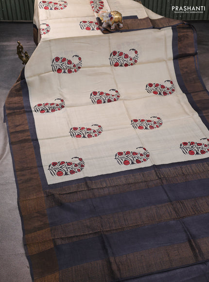 Pure tussar silk saree cream and elephant grey with butta prints and zari woven border