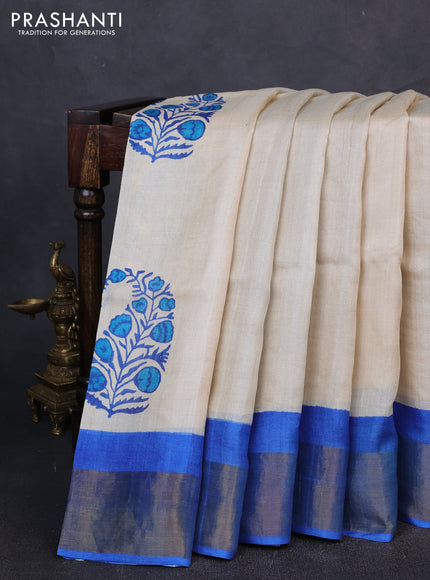Pure tussar silk saree cream and blue with butta prints and zari woven border