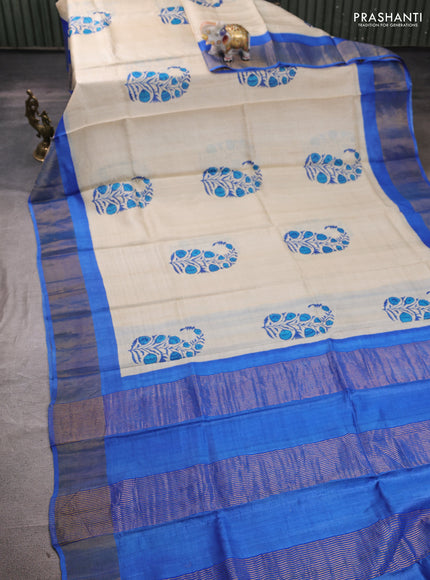 Pure tussar silk saree cream and blue with butta prints and zari woven border