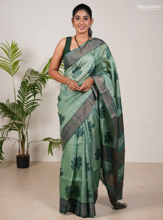 Pure tussar silk saree green shade and green with leaf butta prints and zari woven border