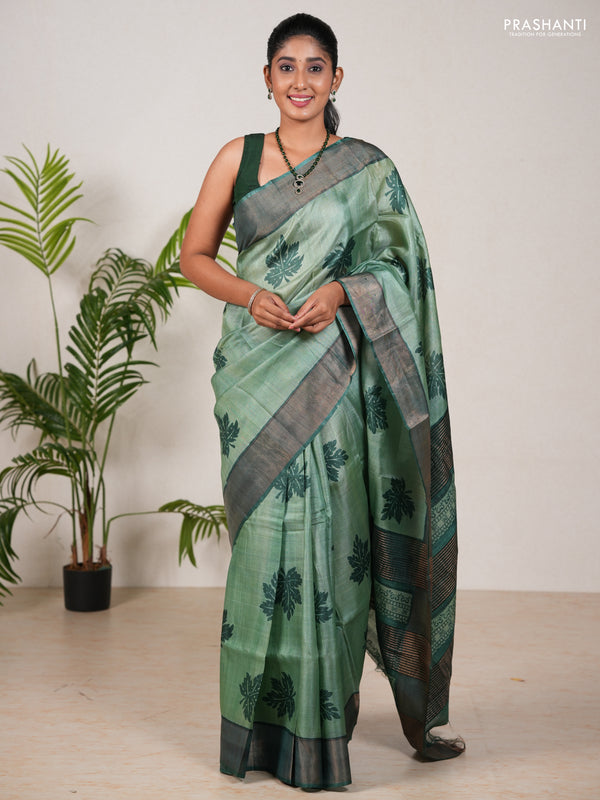 Pure tussar silk saree green shade and green with leaf butta prints and zari woven border