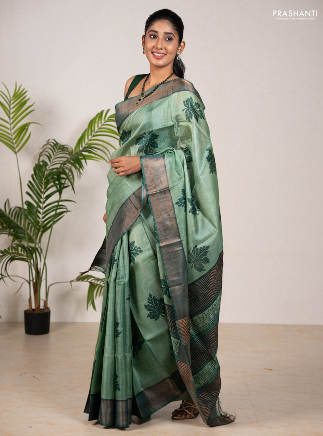 Pure tussar silk saree green shade and green with leaf butta prints and zari woven border