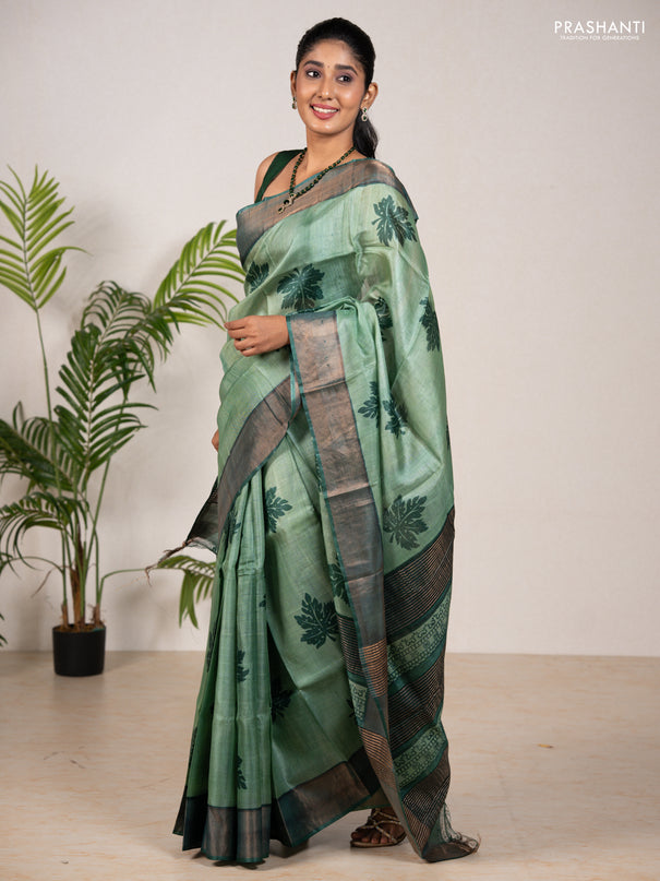 Pure tussar silk saree green shade and green with leaf butta prints and zari woven border