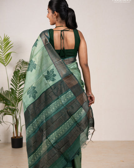 Pure tussar silk saree green shade and green with leaf butta prints and zari woven border