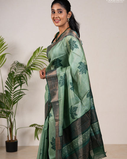 Pure tussar silk saree green shade and green with leaf butta prints and zari woven border