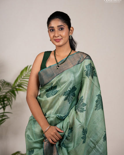 Pure tussar silk saree green shade and green with leaf butta prints and zari woven border