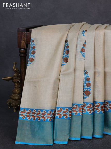 Pure tussar silk saree beige and cs blue with paisley butta prints and zari woven border