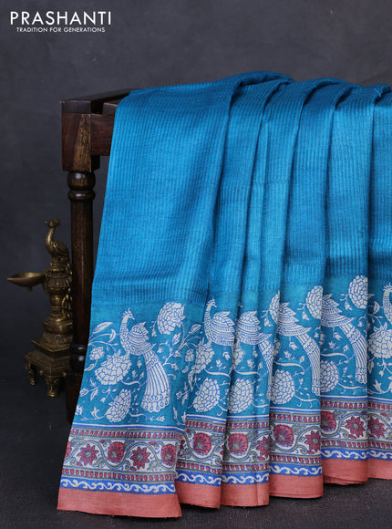 Pure tussar silk saree cs blue and pastel peach with allover block prints and long block printed border