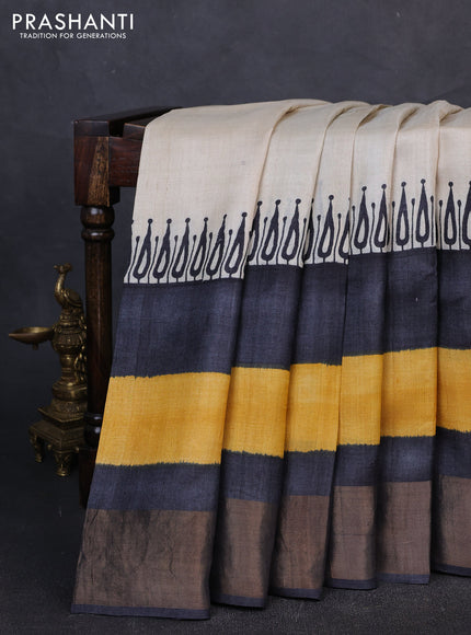 Pure tussar silk saree cream and yellow wirh plain body and long printed zari border