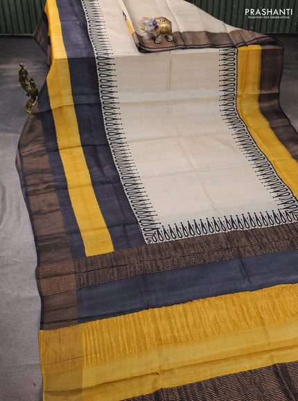Pure tussar silk saree cream and yellow wirh plain body and long printed zari border