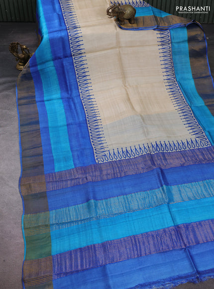 Pure tussar silk saree cream and blue wirh plain body and long printed zari border