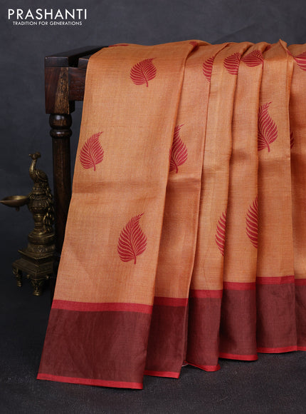 Pure tussar silk saree pale orange and red with leaf butta prints and zari woven border
