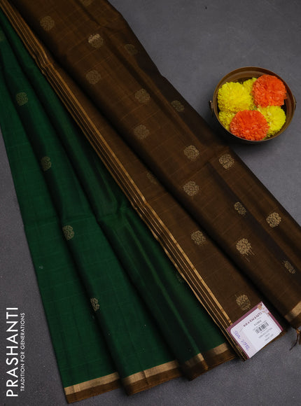 Kora silk cotton saree bottle green and dark mustard with allover zari woven buttas and small zari woven border