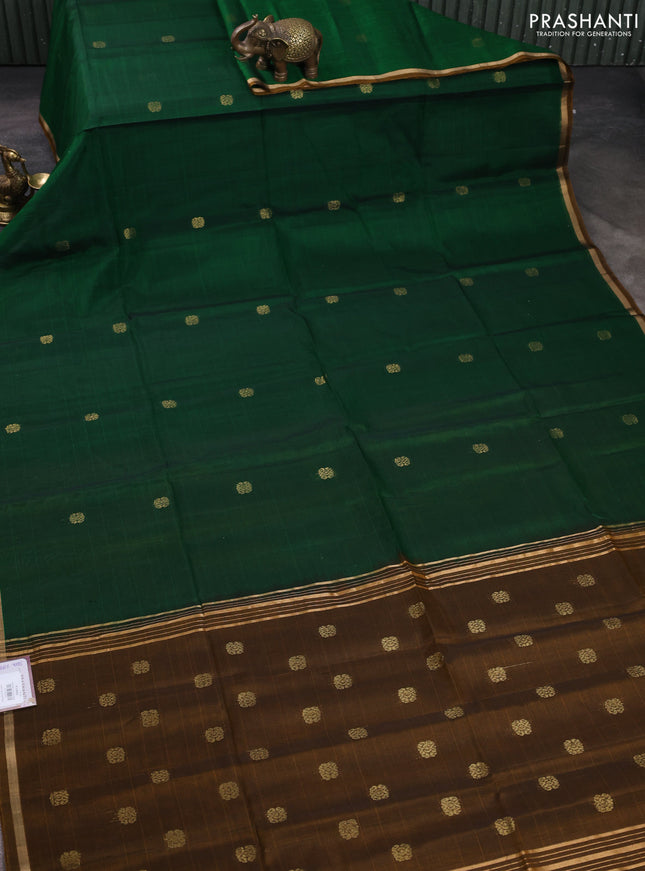 Kora silk cotton saree bottle green and dark mustard with allover zari woven buttas and small zari woven border