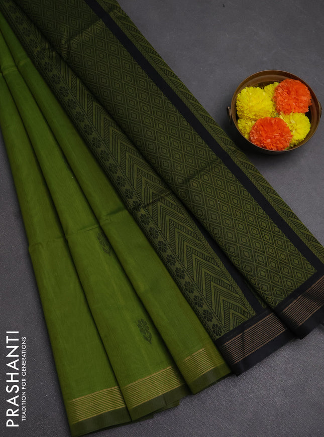 Kora silk cotton saree light green and black with thread woven buttas and small zari woven border