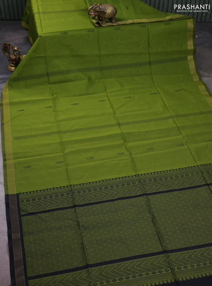 Kora silk cotton saree light green and black with thread woven buttas and small zari woven border