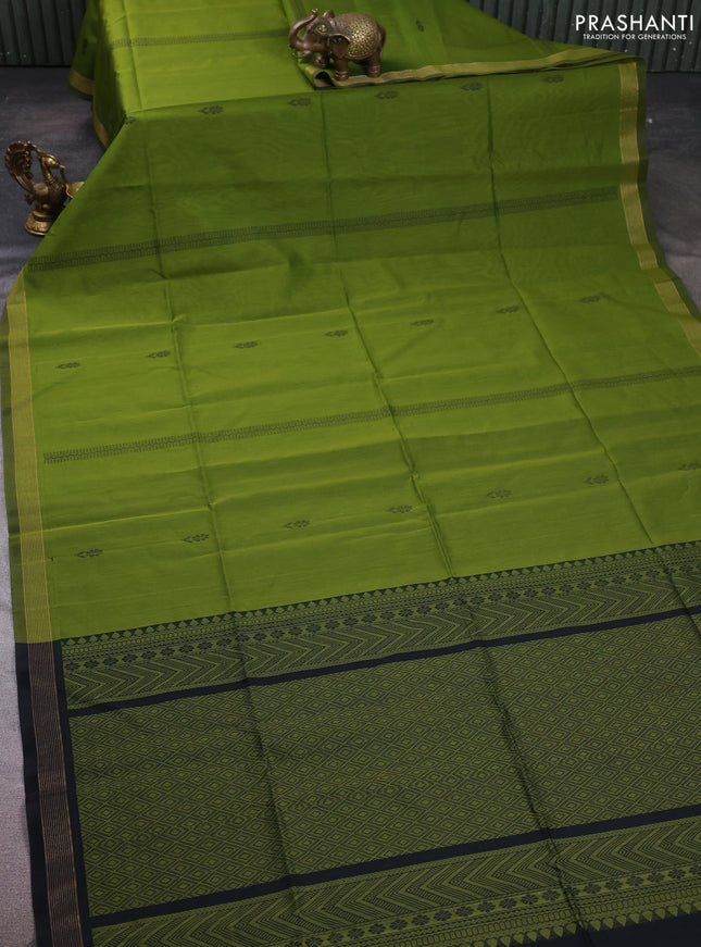 Kora silk cotton saree light green and black with thread woven buttas and small zari woven border
