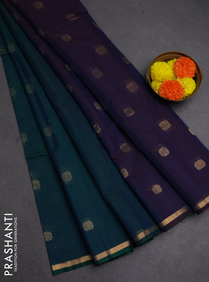 Kora silk cotton saree dual shade of bluish green and bkuish maroon with zari woven buttas and small zari woven border