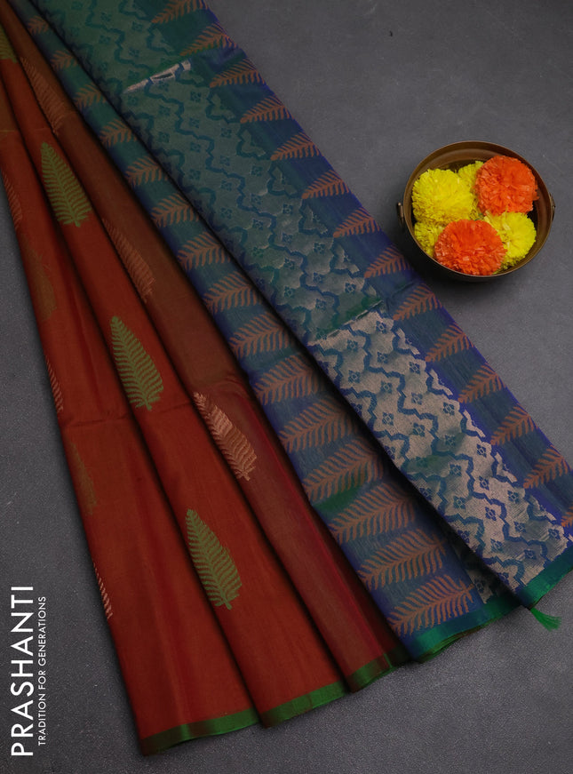 Kora silk cotton saree rust shade and dual shade of bluish green with thread & zari woven leaf buttas and piping border