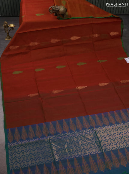 Kora silk cotton saree rust shade and dual shade of bluish green with thread & zari woven leaf buttas and piping border