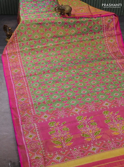 Rajkot patola tissue silk saree green and pink with allover ikat weaves and ikat woven zari border